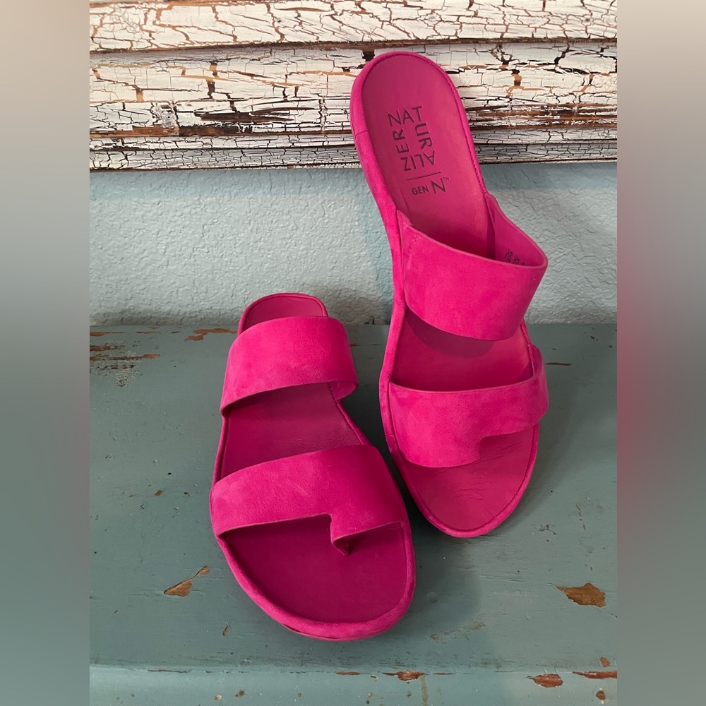 Naturalized hot pink sandals.